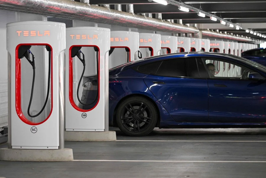 A Tesla electric car is charged at a charging station at a car park in Berlin, Germany on August 3, 2023. - AFP Pic (for illustration purposes only)