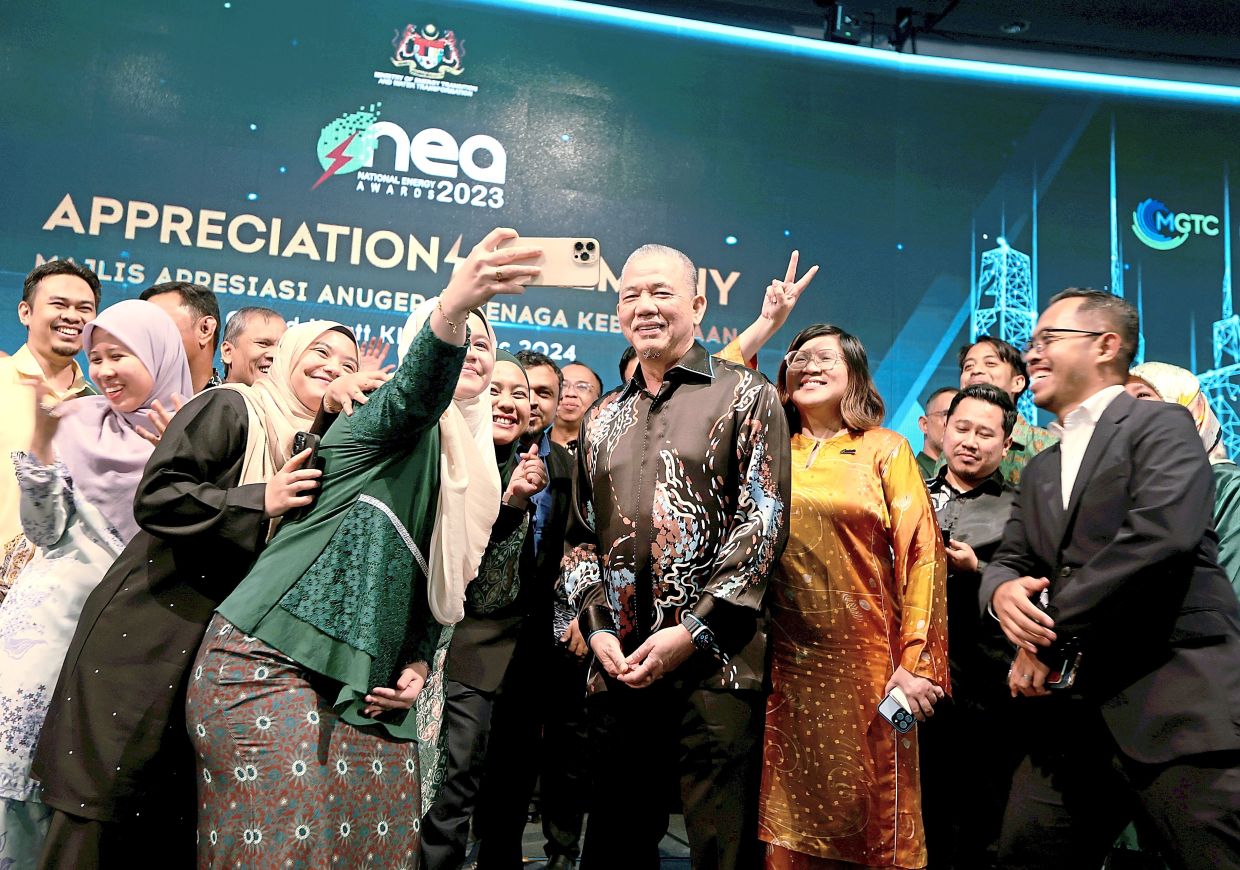 To a green future: Fadillah posing for pictures with attendees during the NEA ceremony in Kuala Lumpur. — CHAN TAK KONG/The Star